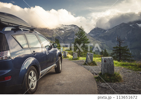 car for traveling with a mountain road 113651672