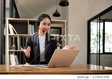 Call center friendly woman asian in office for customer service, technical support and advice, contact and communication with employee operator in help desk agency 113652198