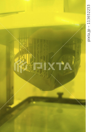 Process SLA 3D printing. Process printing on 3D printer by SLA printing technology. 3D printed object from resin polymerization. Object created on 3D printer from hardened resin. Printing technology 113652253