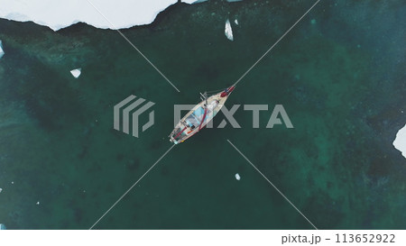 Yacht Sail in Arctic Ocean Aerial Top Down View. Sailing Vessel Explore Polar Nature Chrystal Clear Water for Global Warming Effect Above Drone View 113652922