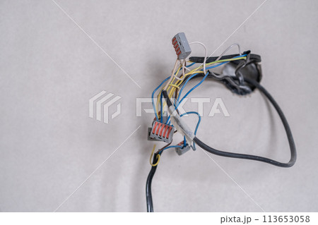 Apartment renovation. Electrical wiring. Wires sticking out of the wall. 113653058