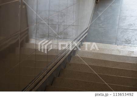 A flight of stairs on the first floor, taken from top to bottom. The concept of coming out of the darkness into the bright world, leaving the bunker or shelter, moral enlightenment A flight of stairs on the first floor, taken from top to bottom. The concept of coming out of the darkness into the bright world, leaving the bunker or shelter, moral enlightenment 113653492
