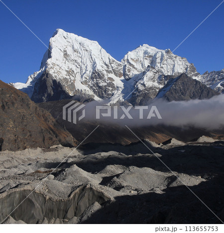 Ngozumba Glacier and high mountains Cholatse and Tobuche, Nepal. 113655753