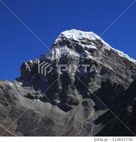 Azure blue sky over a peak near Gokyo, Nepal. 113655756