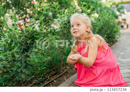 Child walks with cochlear implant system. Installation cochlear implant on child girl ear for restores hearing. Kid hears after hear return to normal. Diversity inclusion concept. Copy space 113657236