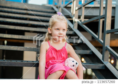 Funny baby with cochlear implant spend time outdoor. Hearing aid and medicine innovating technology and diversity inclusion concept. Copy space Funny baby with cochlear implant spend time outdoor. Hearing aid and medicine innovating technology and diversity inclusion concept. Copy space 113657260