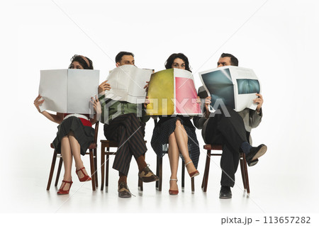 Group of four people, men and women in retro-style clothes sitting on chair and reading newspapers, journals on white background. Group of four people, men and women in retro-style clothes sitting on chair and reading newspapers, journals on white background. 113657282