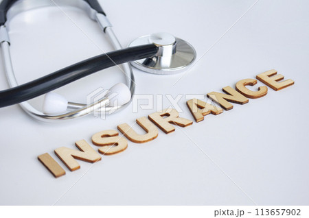 Doctor's stethoscope with Insurance text on white background. Life insurance concept 113657902