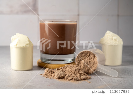 Protein powder and protein drinks, with scoops. Food supplement, bodybuilding, fitness and sport 113657985