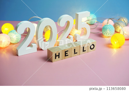 Hello 2025 word alphabet letters on pink and blue background Hello 2025 word alphabet letters on pink and blue background 113658080