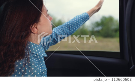 family girl car window, happy face woman smile, laughing road trip, countryside roadtrip fun, carefree journey joy, adventure travel smile, fresh air travel, leisure drive getaway, van ride weekend 113660608