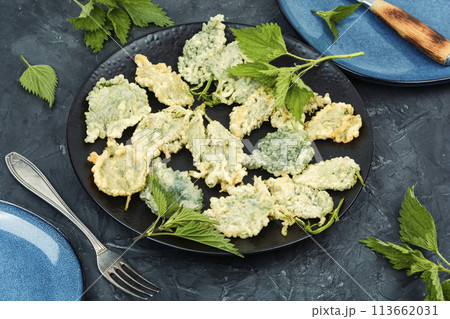 Nettle leaves in batter, vegetarian food. Nettle leaves in batter, vegetarian food. 113662031