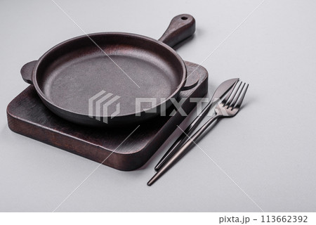 An empty plate on a gray concrete background with copy space 113662392