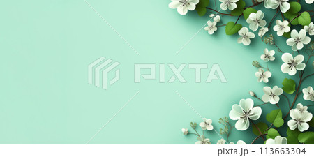 Delicate clover flowers with intricate details, and lush green leaves, arranged at corner against soft teal background, banner with copy space for text for spring themes, invitations, backgrounds 113663304