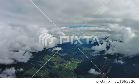 Village in valley and mountain in Alps Village in valley and mountain in Alps 113663520