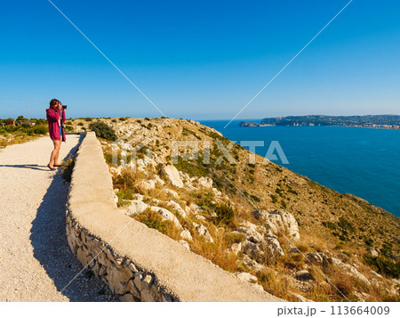 Tourist take photo on Cape San Antonio Tourist take photo on Cape San Antonio 113664009