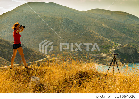 Tourist take photo on nature Mani Greece 113664026