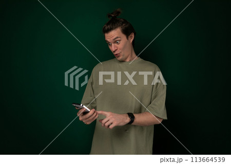 Man Holding Cell Phone in Hand Man Holding Cell Phone in Hand 113664539