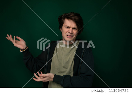 Man in Black Jacket Holding Out His Hands Man in Black Jacket Holding Out His Hands 113664722