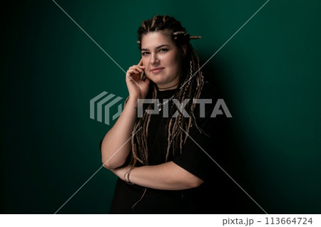 Woman With Dreadlocks Talking on a Cell Phone Woman With Dreadlocks Talking on a Cell Phone 113664724