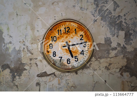 Old broken rusty wall clock in an abandoned building in Pripyat, Chornobyl Exclusion zone, Ukraine Old broken rusty wall clock in an abandoned building in Pripyat, Chornobyl Exclusion zone, Ukraine 113664777