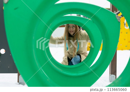 Woman Seen Through Green Sculpture Woman Seen Through Green Sculpture 113665060