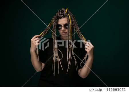 Man With Dreadlocks Holding Hair in Front of His Face 113665071