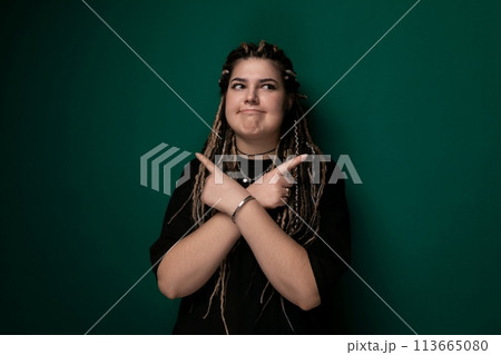 Woman With Dreadlocks Making a Peace Sign 113665080