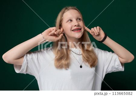 Woman Posing With Hands on Ears 113665082