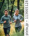 Man and Woman Running in the Woods 113665128