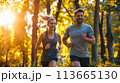 Man and Woman Running in the Woods 113665130