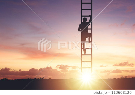 Silhouette of a man crawling on a staircase to the sky, concept of motivation and success 113668120