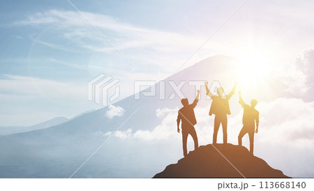 Silhouette of a team celebrating a victory against sunset background, concept of victory and leadership 113668140