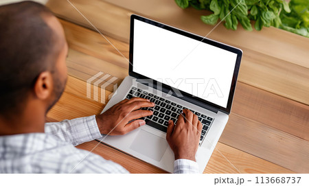 Mastering Productivity, Man Typing on a Laptop on a Wooden Desk, Top View, Generative AI 113668737