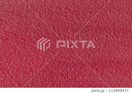 Rough wall plaster concrete crimson color solid surface stucco cement structure background texture abstract 113669477