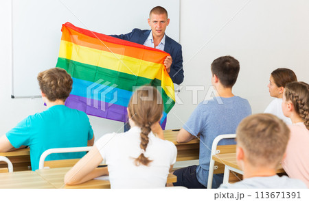Teacher discussing with teenage students about LGBT in classroom Teacher discussing with teenage students about LGBT in classroom 113671391