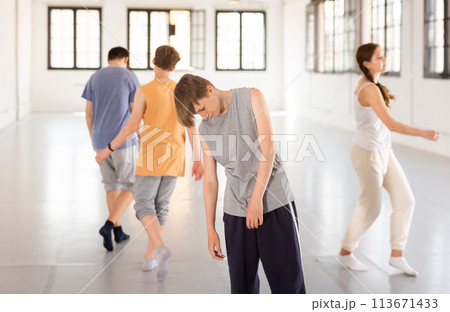 Boy practicing contemporary dance at studio Boy practicing contemporary dance at studio 113671433