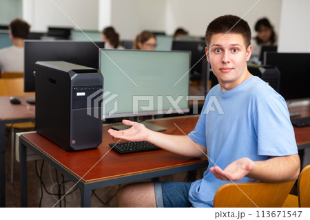 Teenager surprised by not working computer in school class Teenager surprised by not working computer in school class 113671547