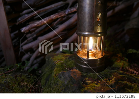 Camping at Lake Kawaguchi, Mt. Fuji in Japan. Beautiful warm light oil lamps, gasoline lanterns and logs. Camping at Lake Kawaguchi, Mt. Fuji in Japan. Beautiful warm light oil lamps, gasoline lanterns and logs. 113672199