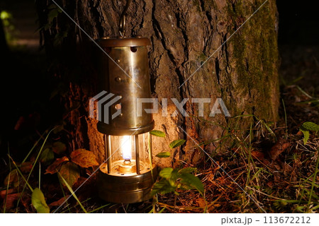 Camping at Lake Kawaguchi, Mt. Fuji in Japan. Beautiful warm light oil lamps, gasoline lanterns and logs. Camping at Lake Kawaguchi, Mt. Fuji in Japan. Beautiful warm light oil lamps, gasoline lanterns and logs. 113672212