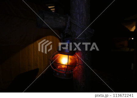 Camping at Lake Kawaguchi, Mt. Fuji in Japan. Beautiful warm light oil lamps, gasoline lanterns and logs. Camping at Lake Kawaguchi, Mt. Fuji in Japan. Beautiful warm light oil lamps, gasoline lanterns and logs. 113672241