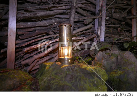 Camping at Lake Kawaguchi, Mt. Fuji in Japan. Beautiful warm light oil lamps, gasoline lanterns and logs. 113672255
