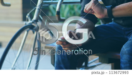 Image of 5g 5th generation text over man using smartphone in background 113672993