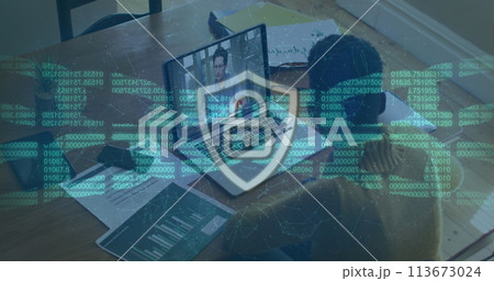 Security padlock and chain against woman having a image call with male colleague on laptop at office 113673024