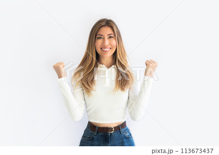 Image of happy surprised young girl isolated on white wall background making winner gesture. Image of happy surprised young girl isolated on white wall background making winner gesture. 113673437