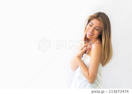 Beautiful gorgeous woman looking at camera isolated on white. Beauty healthy facial skin care 113673474