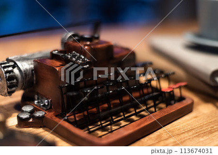 typewriter with a cup of coffee 113674031