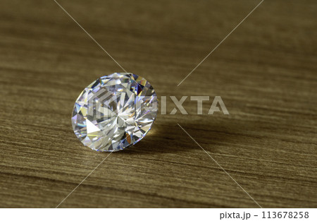 diamond on wooden background 113678258