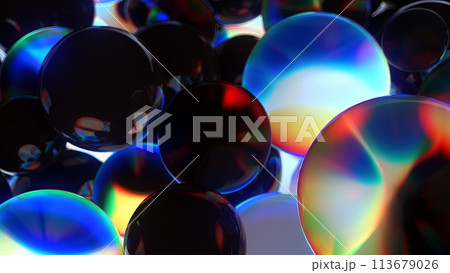 An array of dark spheres with a colorful glare.. 113679026