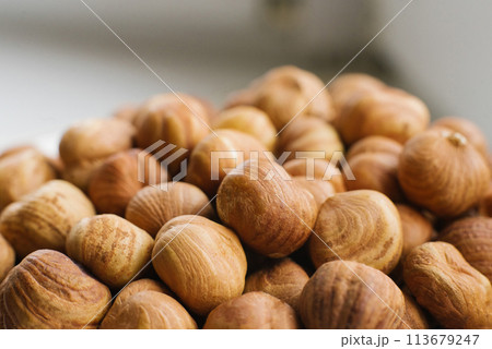 Hazelnuts close-up on a plate 113679247